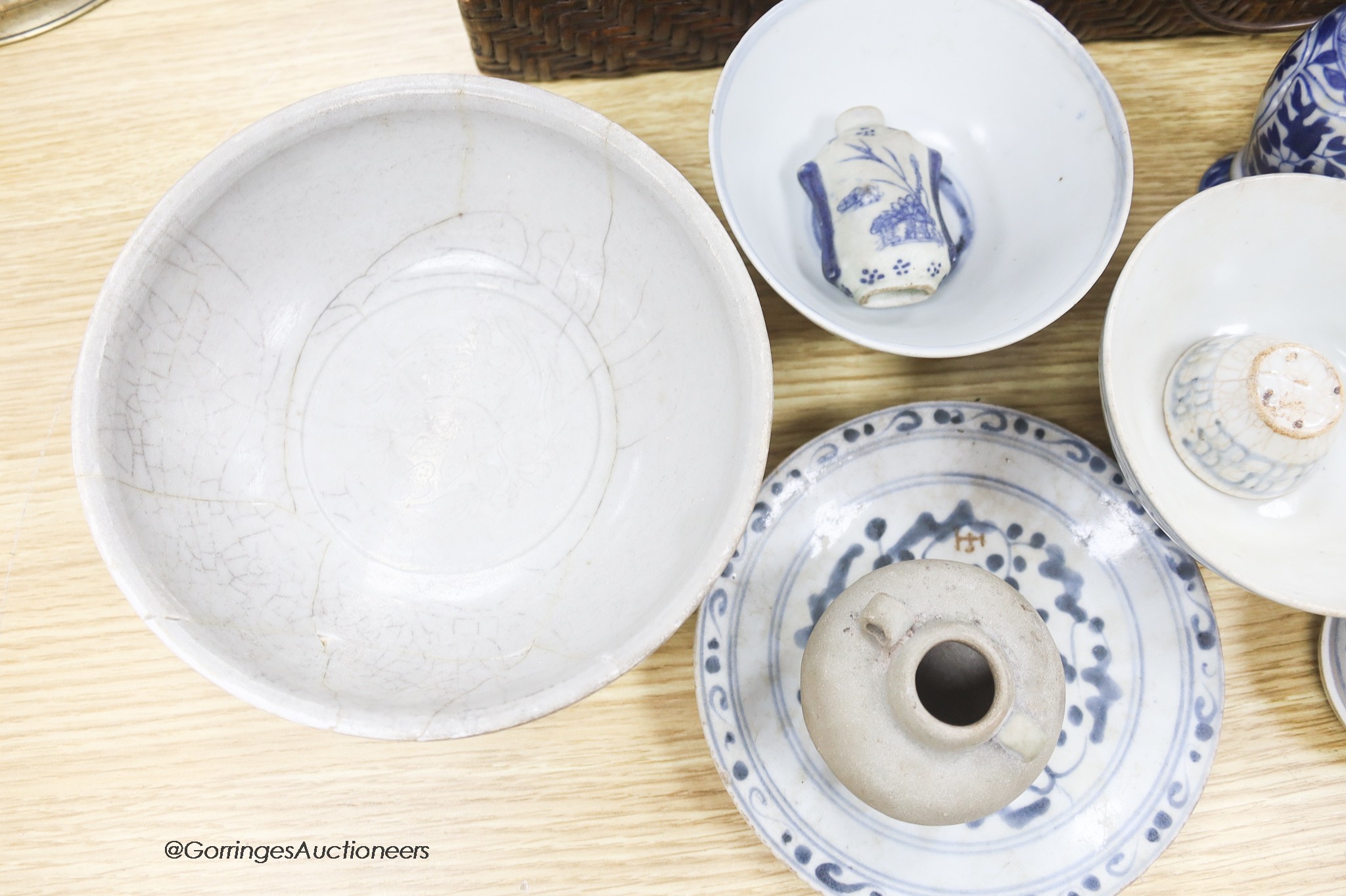 A collection of Chinese and Annamese shipwreck ceramics, Song to 19th century including bowls and vases, together with two graduated wicker baskets